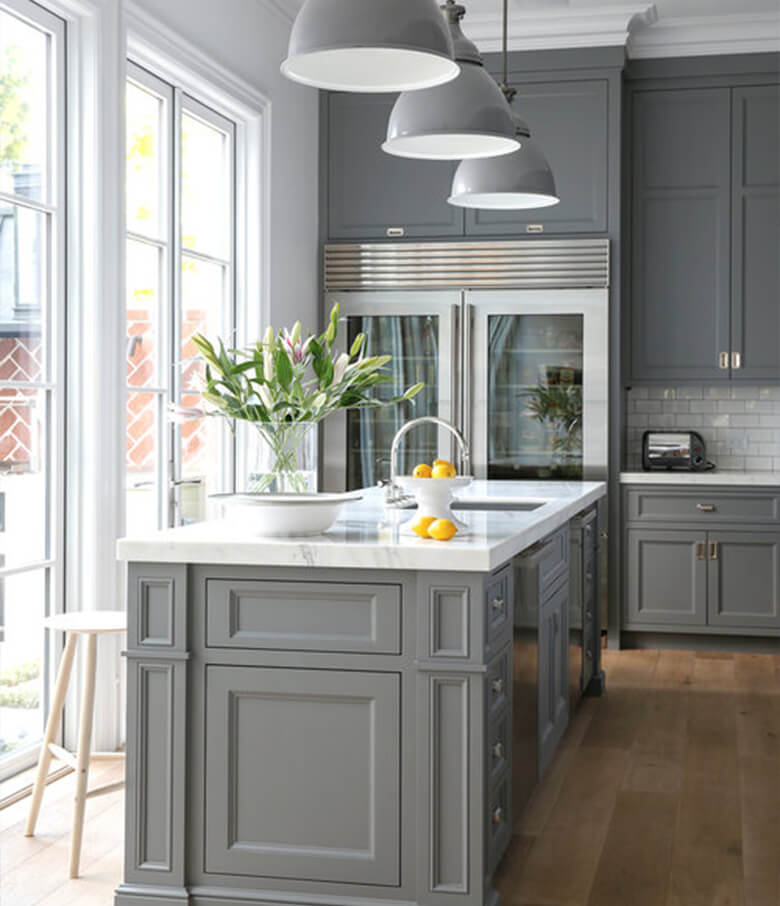 Modern traditional kitchen with tall gray cabinets and large island.